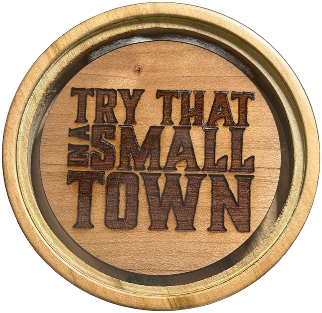 The Try That in a Small Town call: a hand-turned wood pot call with a laser-engraved 'Try That in a Small Town' design and a crystal striking surface inset at the center.